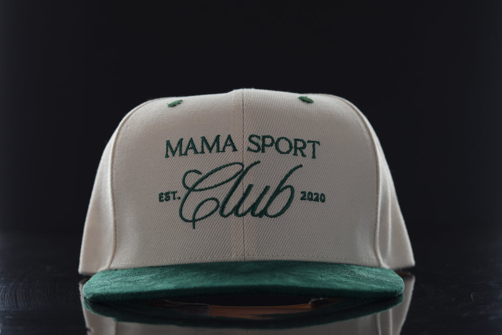 White cap with green brim featuring 'Mama Sport Club' text on a black background